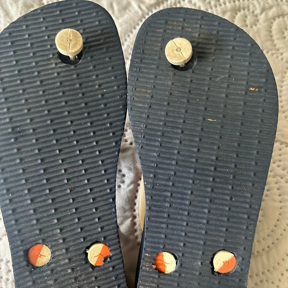 Havana’s flip flops size 29/30 (11-12). Navy base w/orange strap. Great shape!